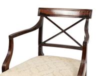 A Set of Six Regency Style Mahogany Dining Chairs and Two Armchairs