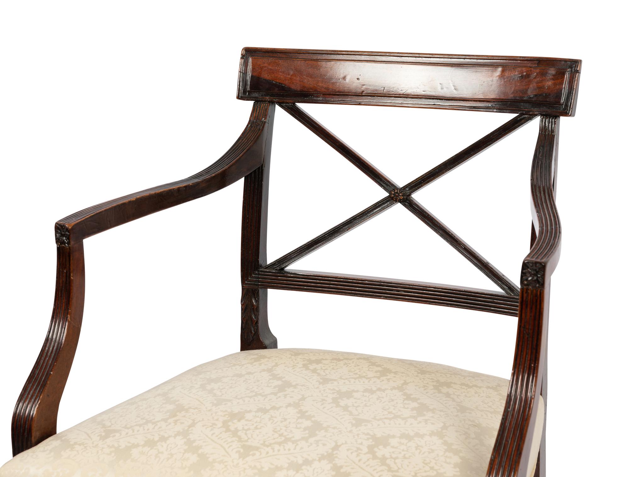 A Set of Six Regency Style Mahogany Dining Chairs and Two Armchairs