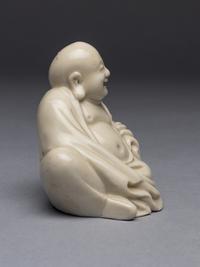 A Blanc-de-Chine Porcelain Figure of Budai Buddha
