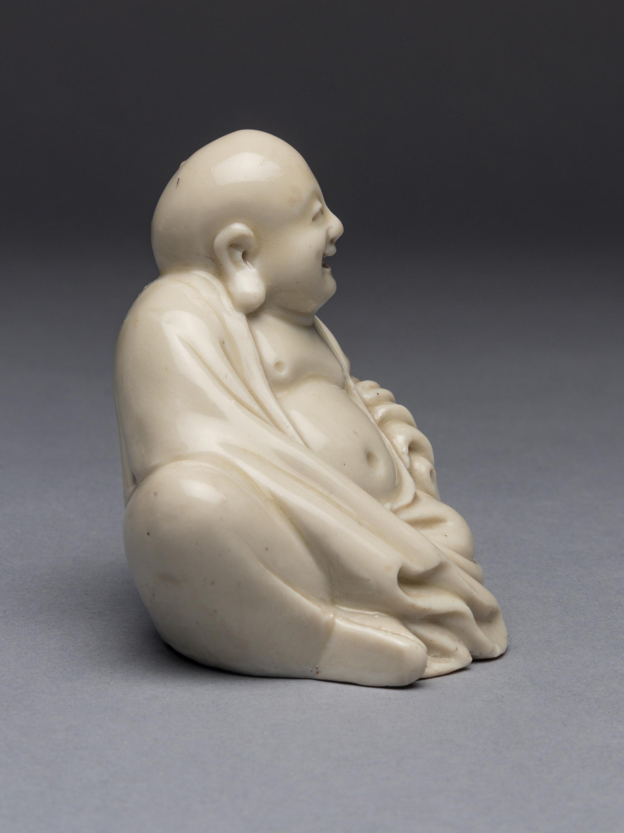 A Blanc-de-Chine Porcelain Figure of Budai Buddha