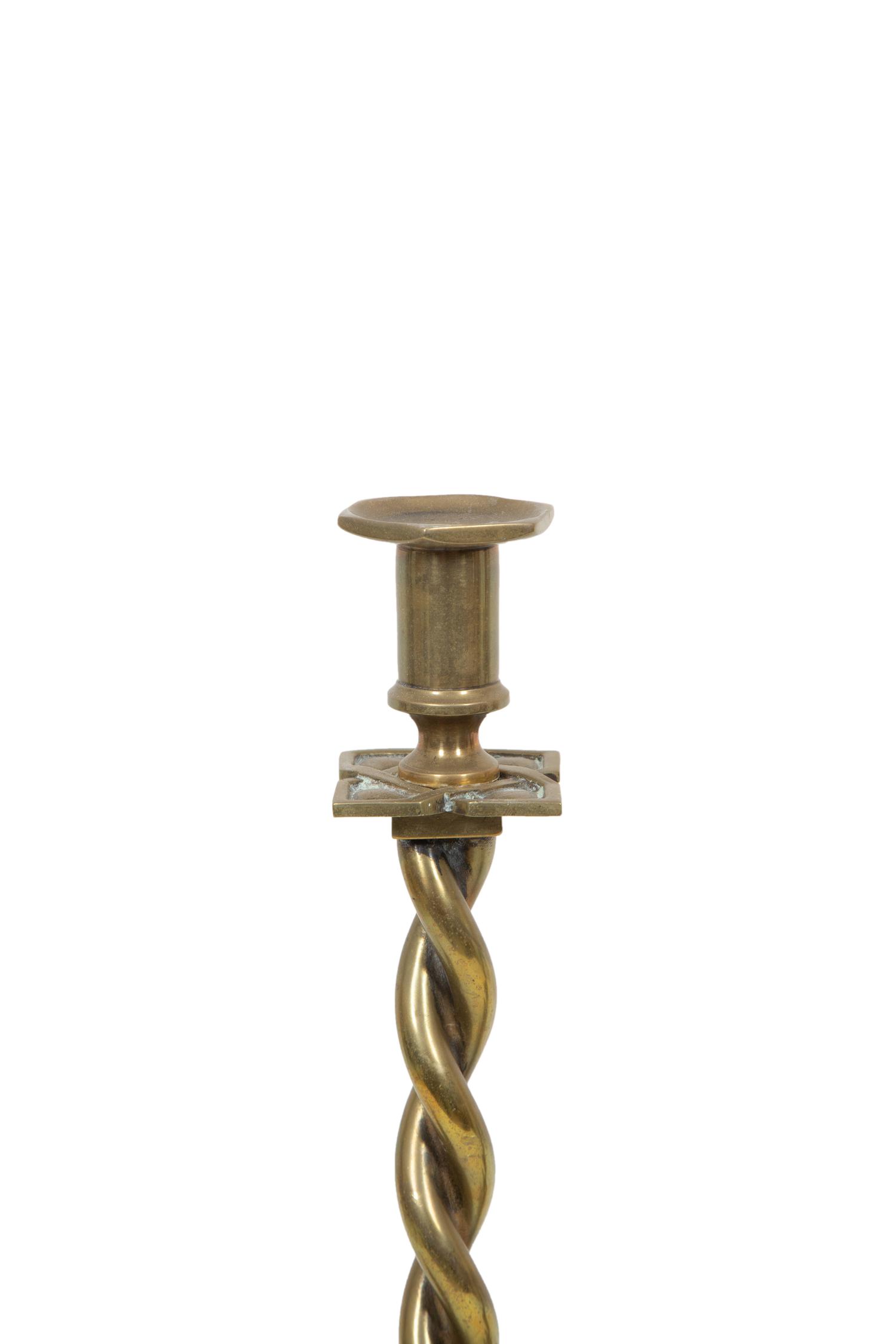 A Pair of Brass Candlesticks and a Pair of Chambersticks