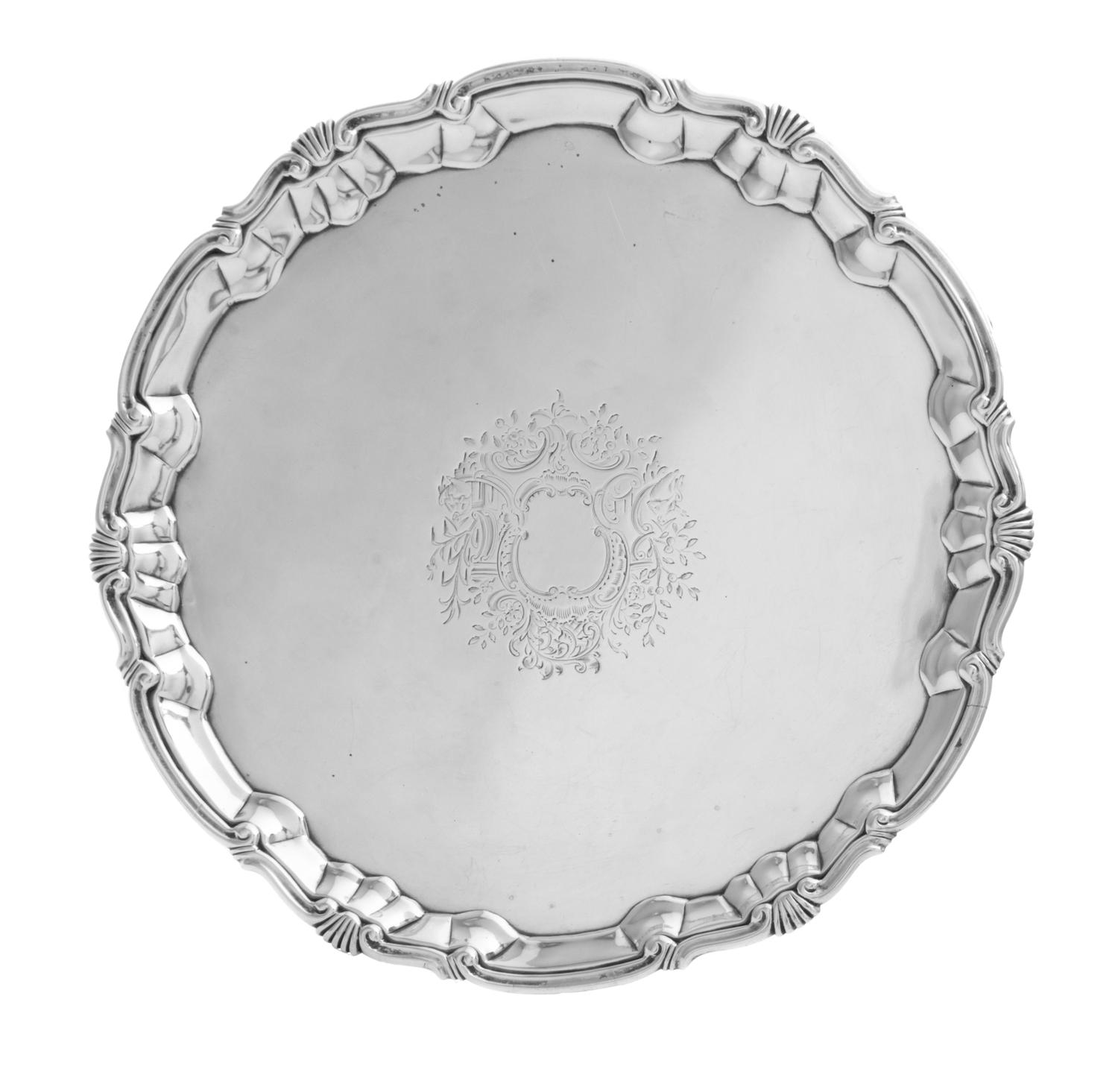 A George II Silver Salver, William Peaston, London, 1749, having a shell border and chased with foliate design surrounding a vacant car
