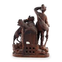 A Swiss "Black Forest" Carved Oak Figural Mantel Clock