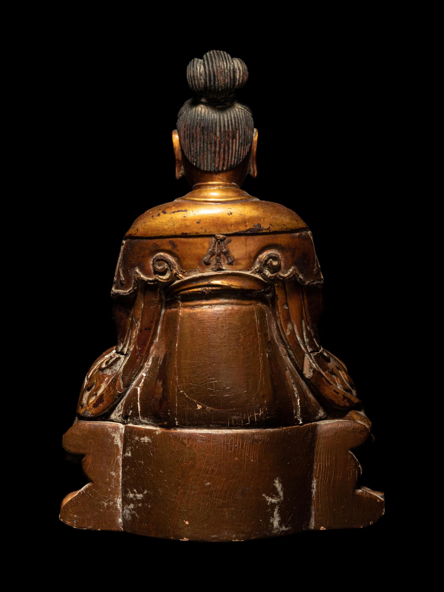 A Gilt Wood Figure of Seated Guanyin