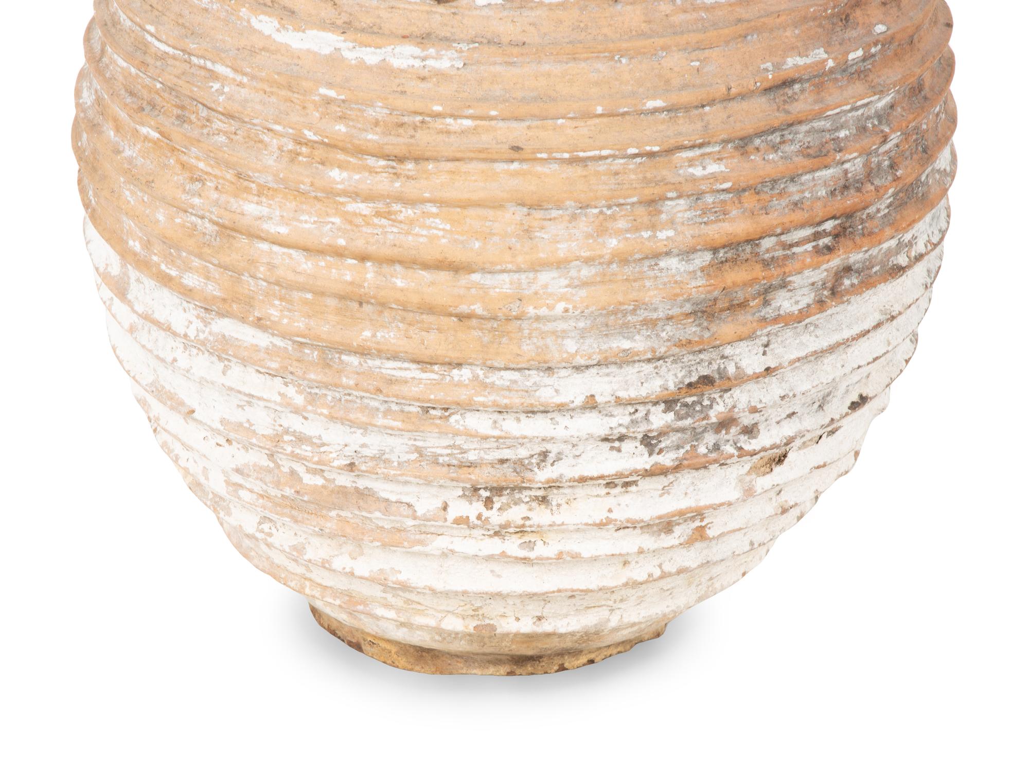 A Large Terra Cotta Jar with Traces of White Pigment — 20TH CENTURY