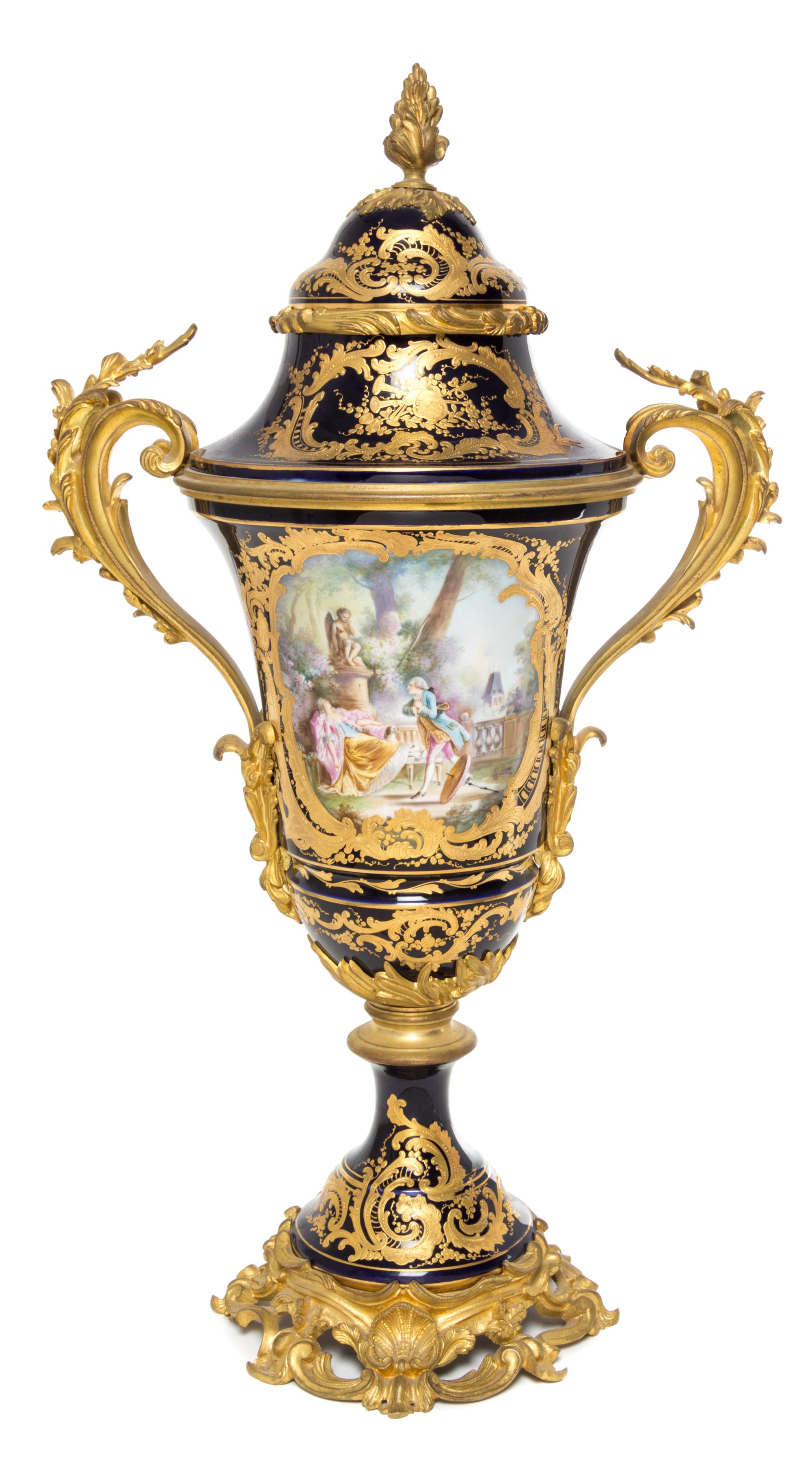 A Sevres Gilt Bronze Mounted Porcelain Urn Height 26 1/4 inches.