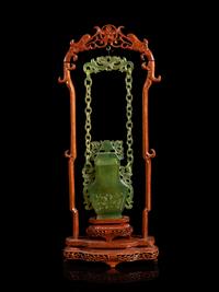 A Chinese Carved Serpentine Hanging Covered Vase