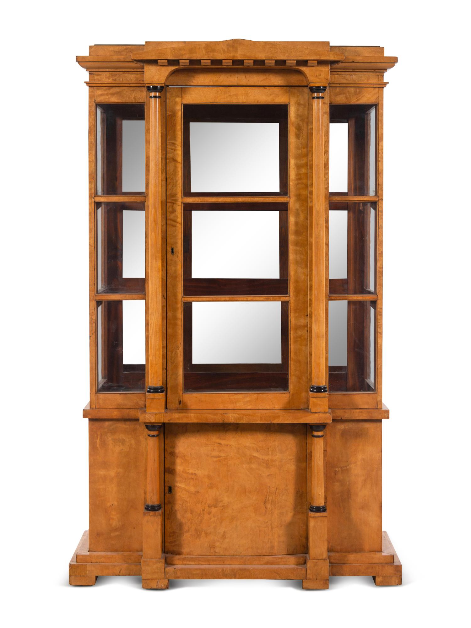 A German or Austrian Neoclassical Parcel Ebonized Birch Breakfront Vitrine Cabinet