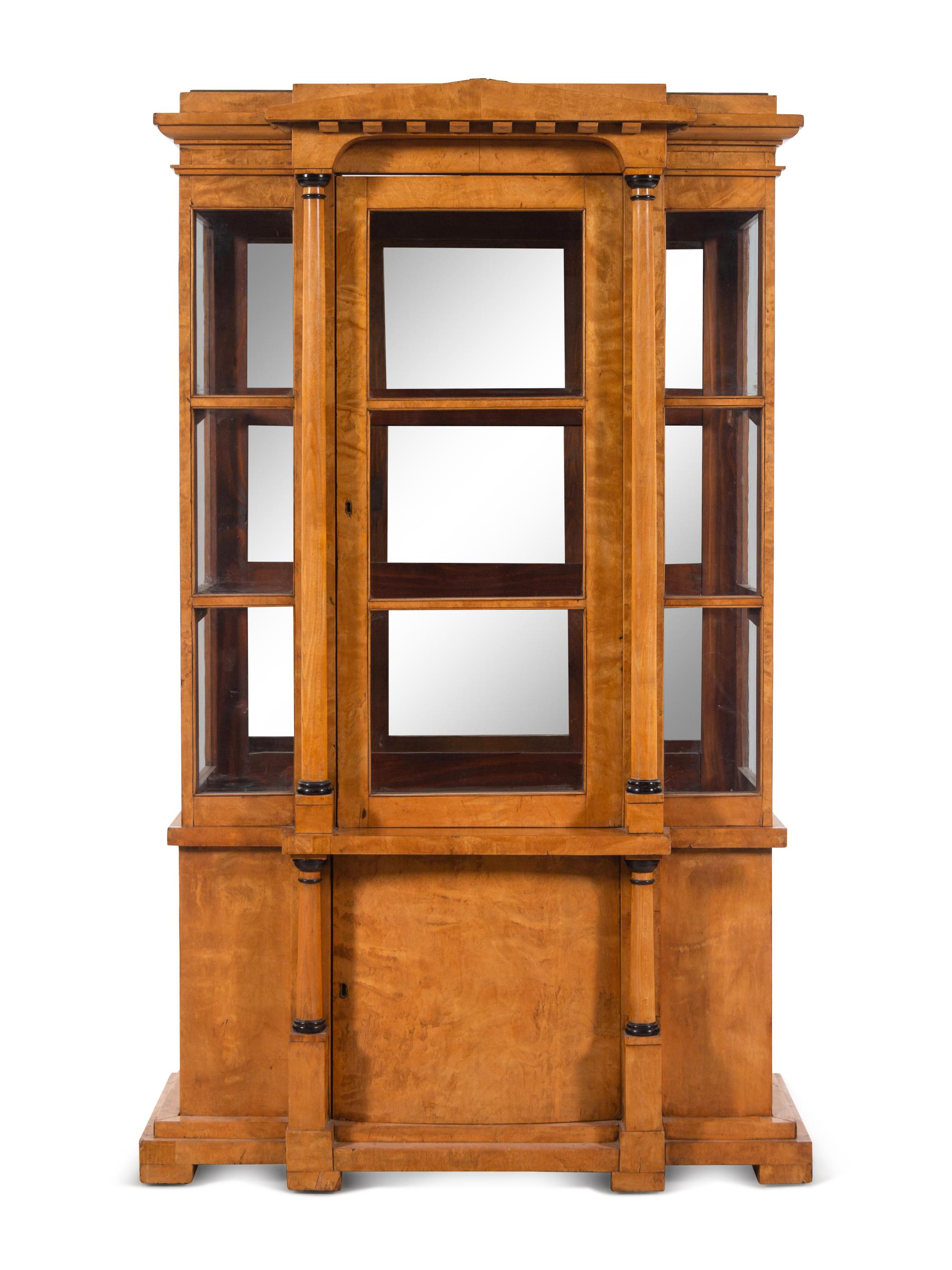 A German or Austrian Neoclassical Parcel Ebonized Birch Breakfront Vitrine Cabinet