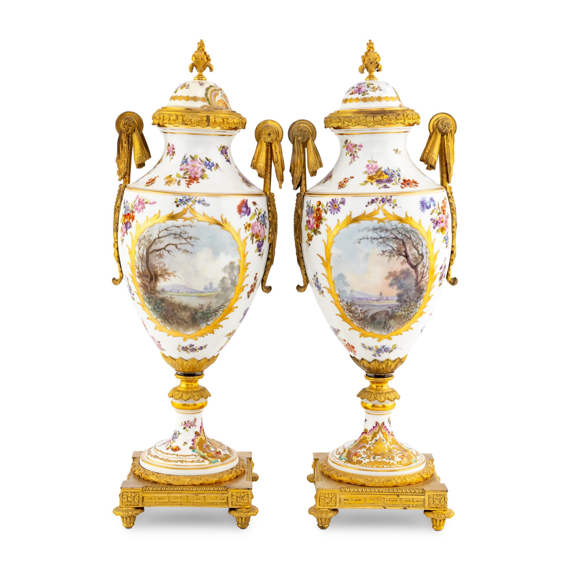 A Pair of Sèvres Style Porcelain and Gilt Bronze Mounted Urns