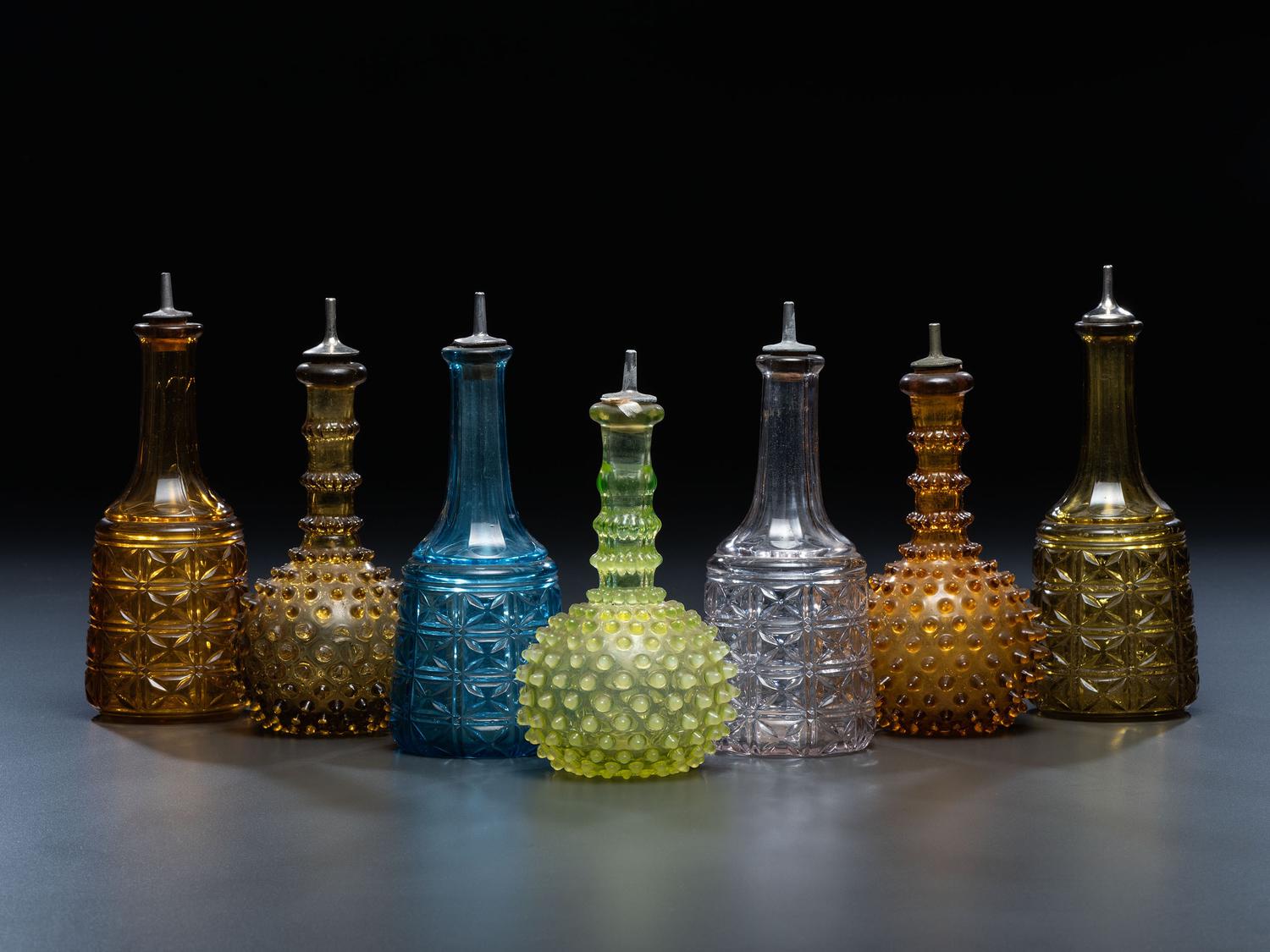 Seven Glass Barber Bottles