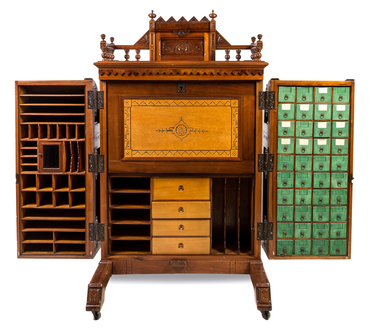 A Wooton Walnut Patent Secretary Desk Height of desk 70 1/2 x width 42 1/2 x depth 31 1/2 inches. — LATE 19TH CENTURY