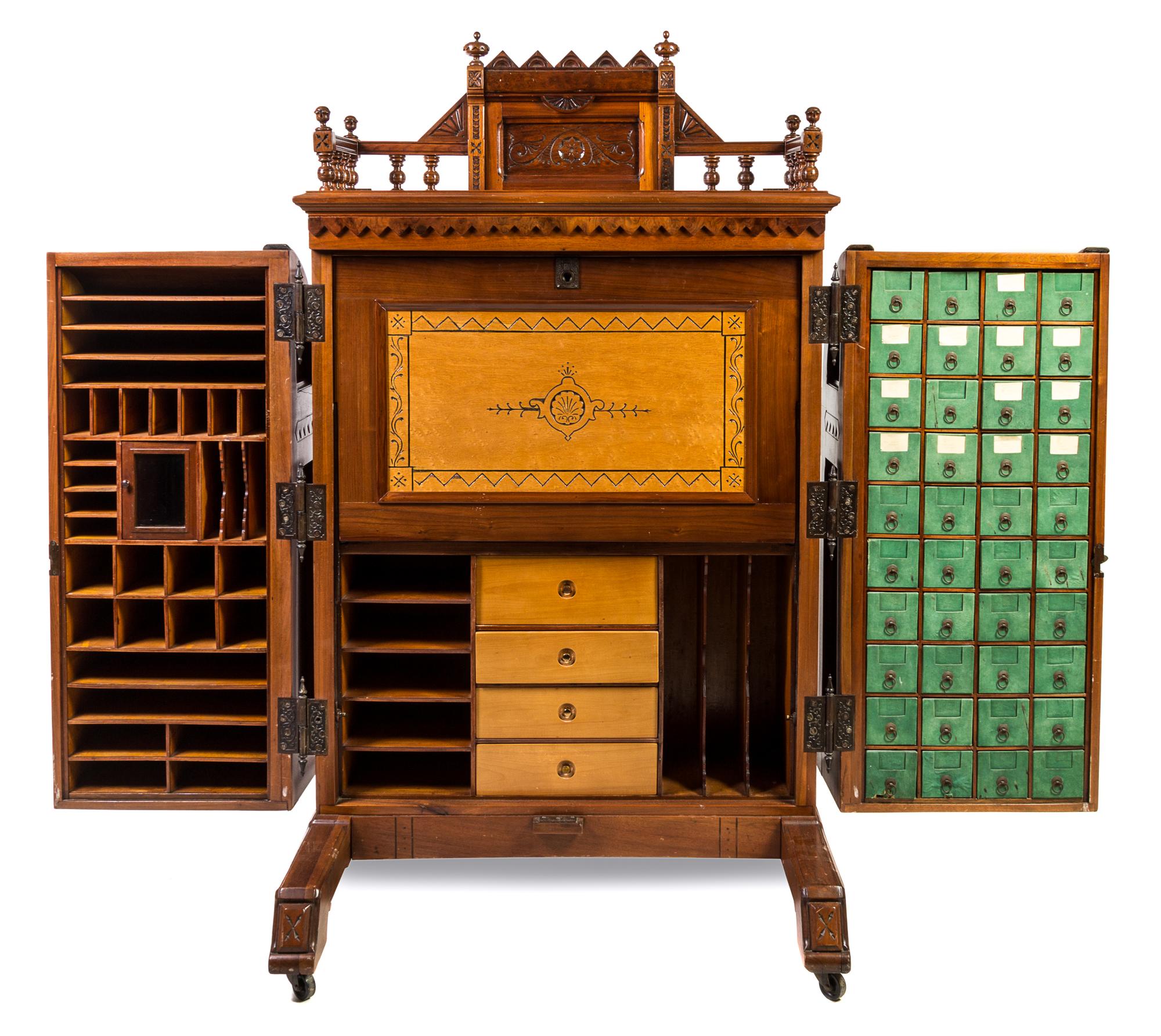 A Wooton Walnut Patent Secretary Desk Height of desk 70 1/2 x width 42 1/2 x depth 31 1/2 inches. — LATE 19TH CENTURY
