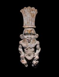 An Egyptian Bichrome Faience Double-Sided Bes