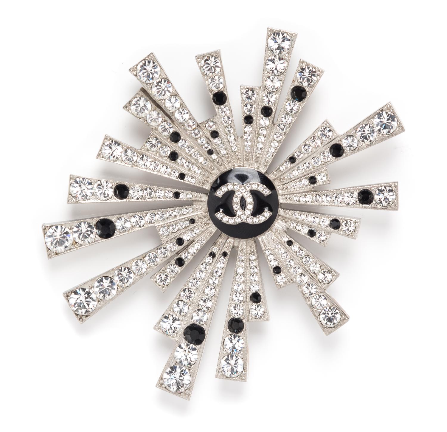 A Chanel Rhinestone Starburst Brooch, 3.5" x 4".