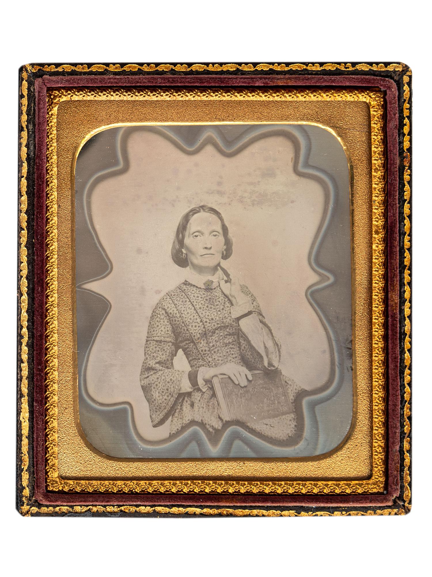 [EARLY PHOTOGRAPHY]. A collection of 11 daguerreotypes featuring artistic borders, including: