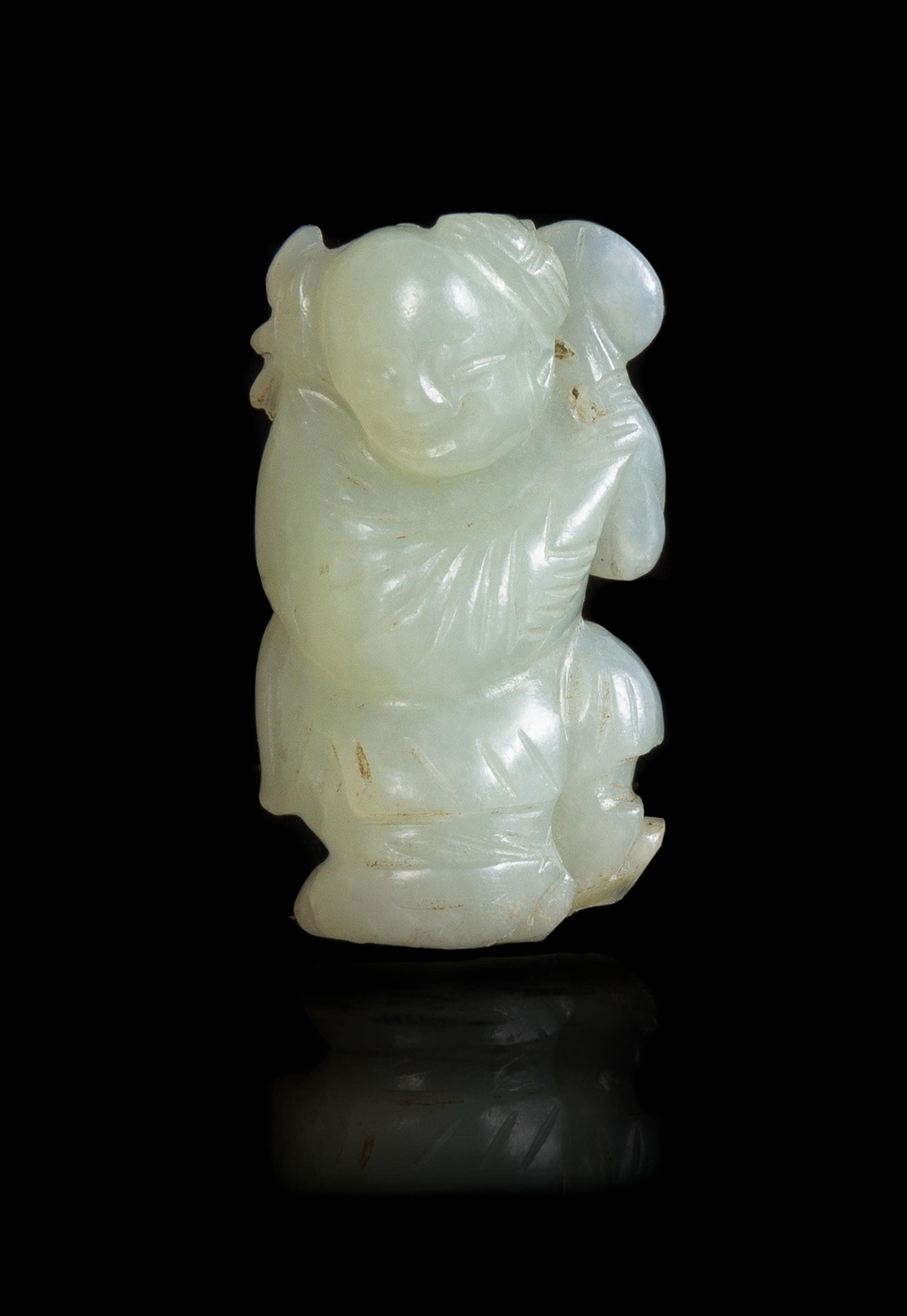 A Chinese Pale Celadon Jade Figure of a Boy Height 1 7/8 inches. — 18TH/19TH CENTURY