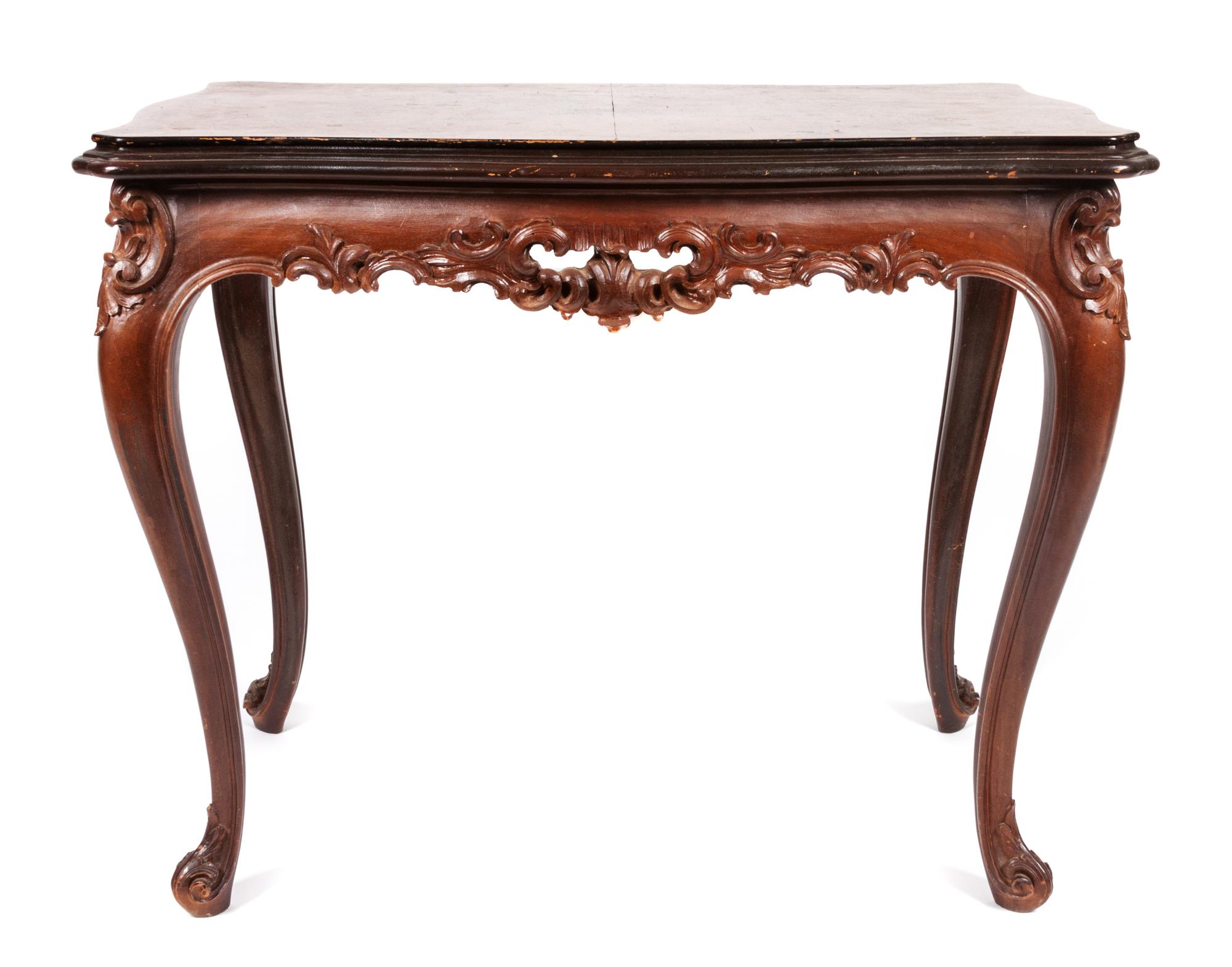 A Louis XV Style Carved Occasional Table Height 23 1/2 x width 29 1/2 x depth 19 1/4 inches.