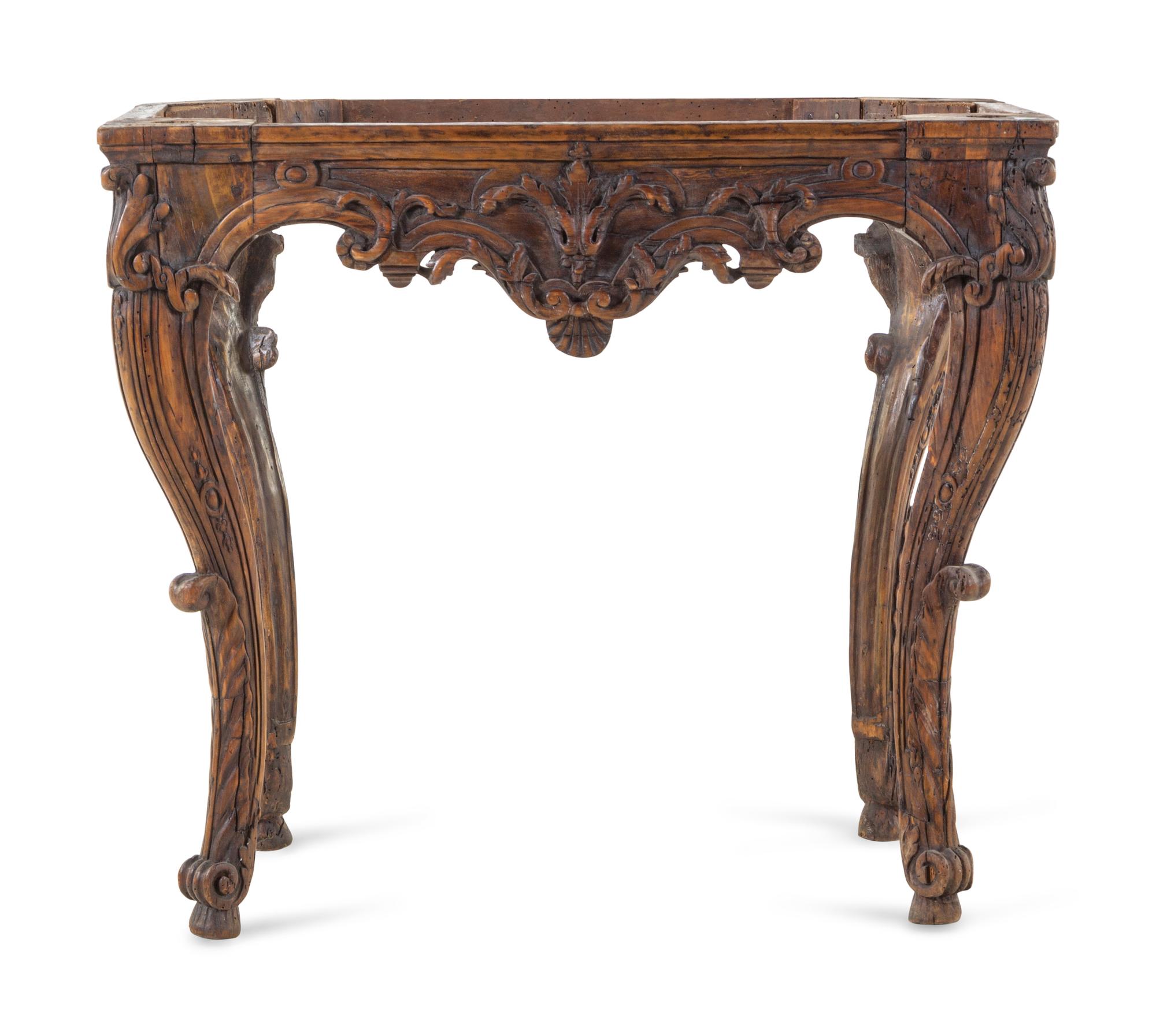 An Italian or French Carved Fruitwood Table