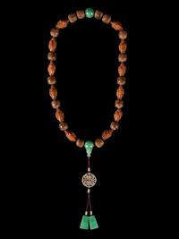 A Jadeite and Nut Bead Necklace