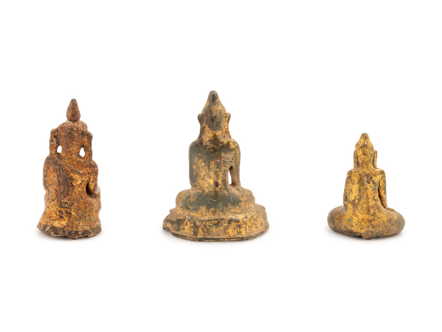 Three Thai Parcel-Gilt Bronze Figures of Buddha