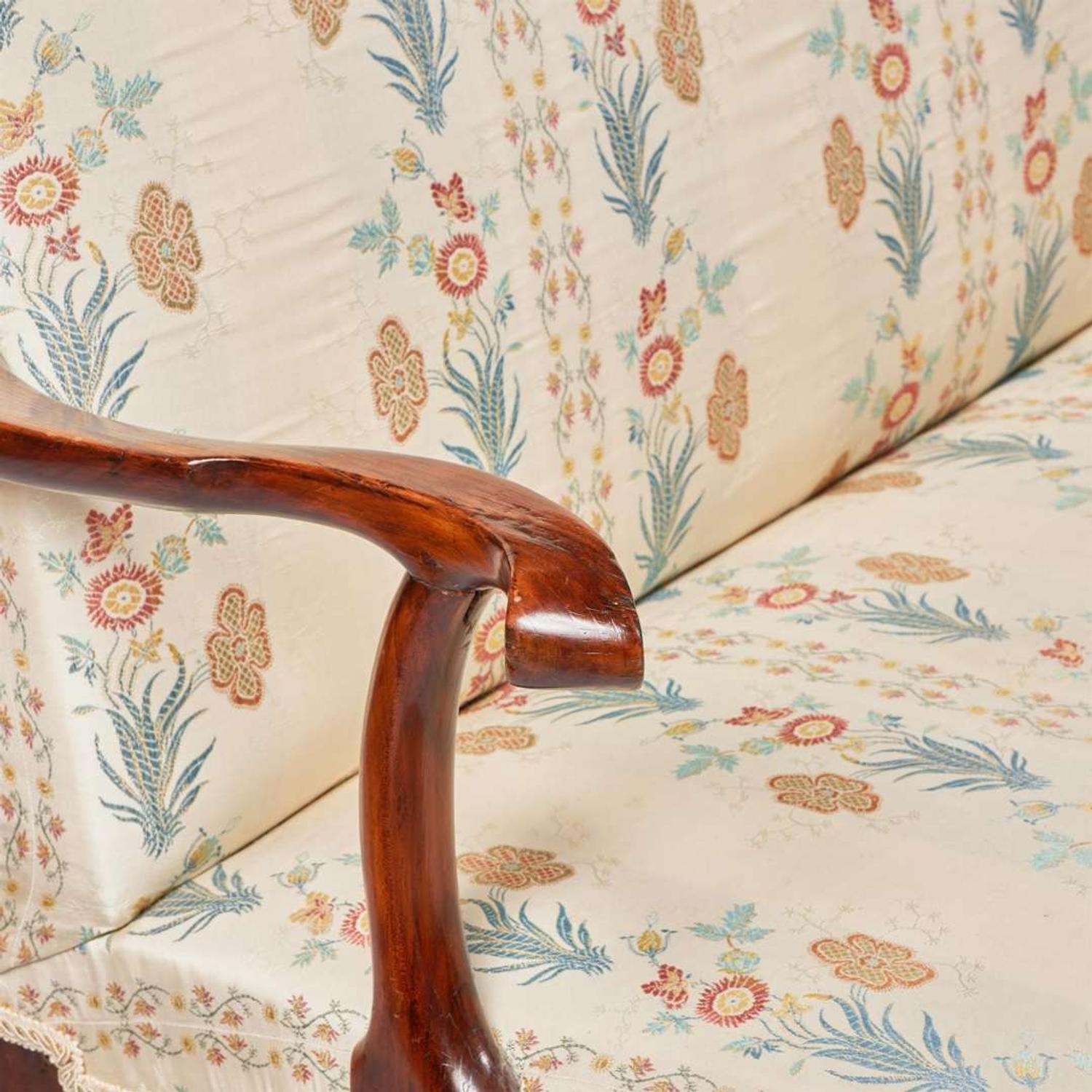 A George I carved walnut settee circa 1720