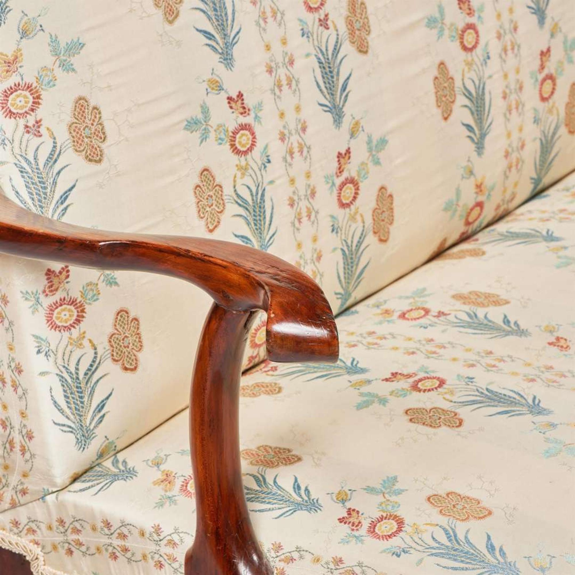 A George I carved walnut settee circa 1720