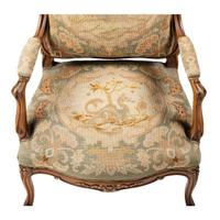 A Louis XV Style Carved Walnut and Needlework Upholstered Fauteuil
