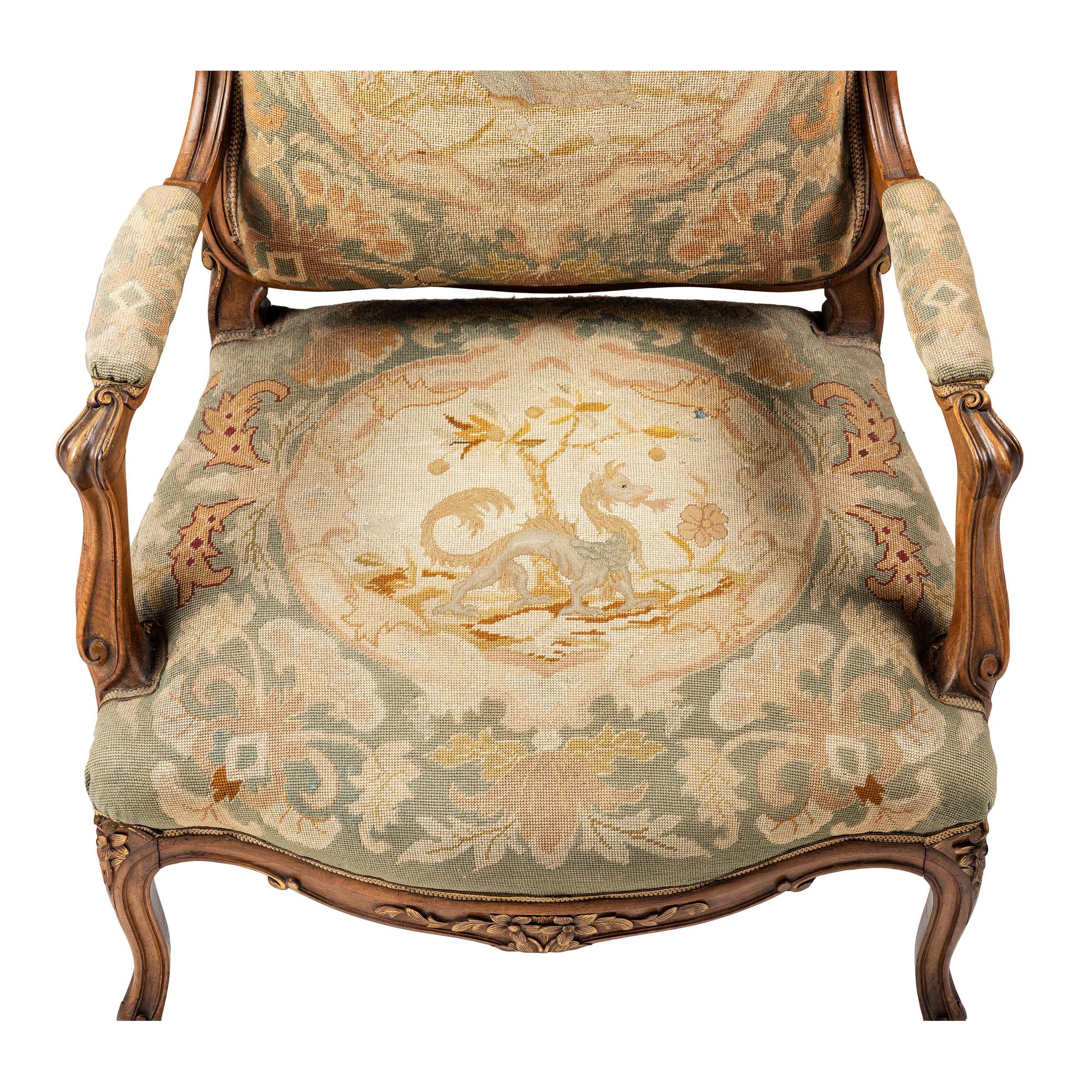 A Louis XV Style Carved Walnut and Needlework Upholstered Fauteuil