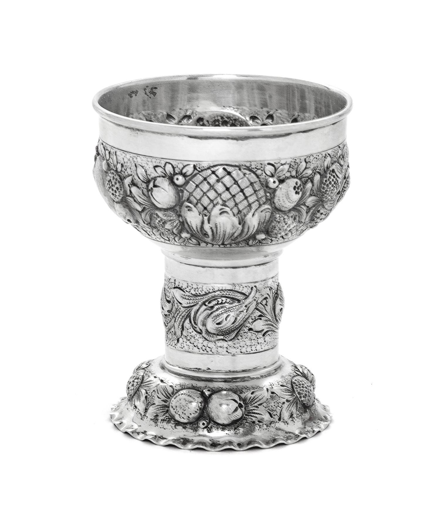 A Dutch Silver Cup, 19TH CENTURY, worked with bands of repousse fruit.