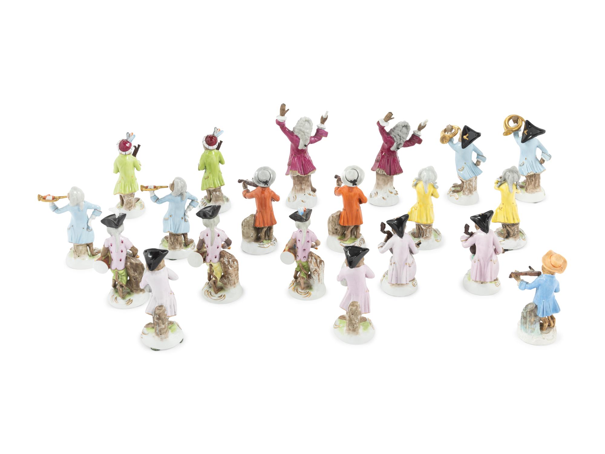 An Assembled Group of Nineteen Sitzendorf Porcelain Monkey Band Figures