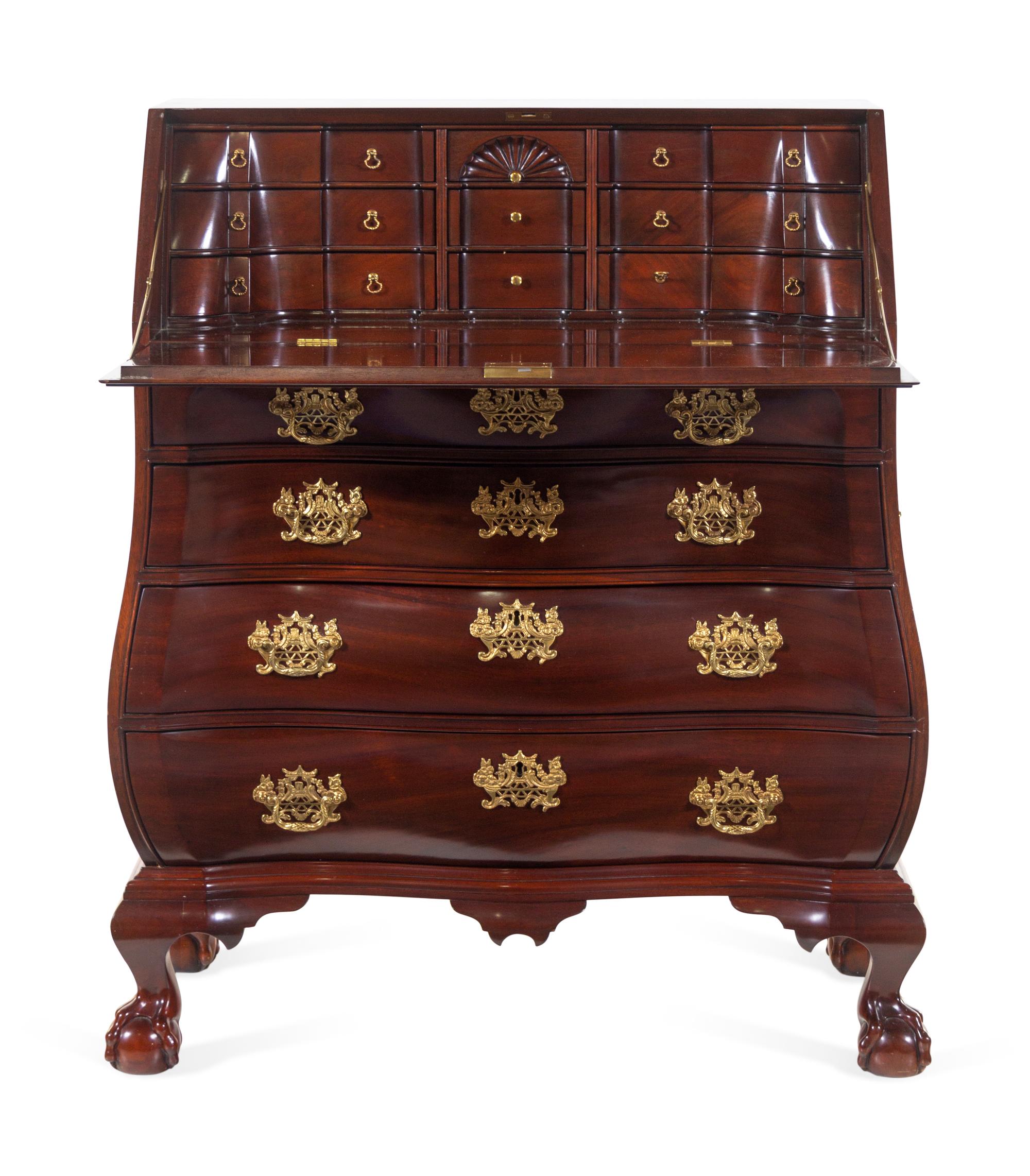 A Chippendale Style Carved Mahogany Bombe-Form Slant-Front Desk