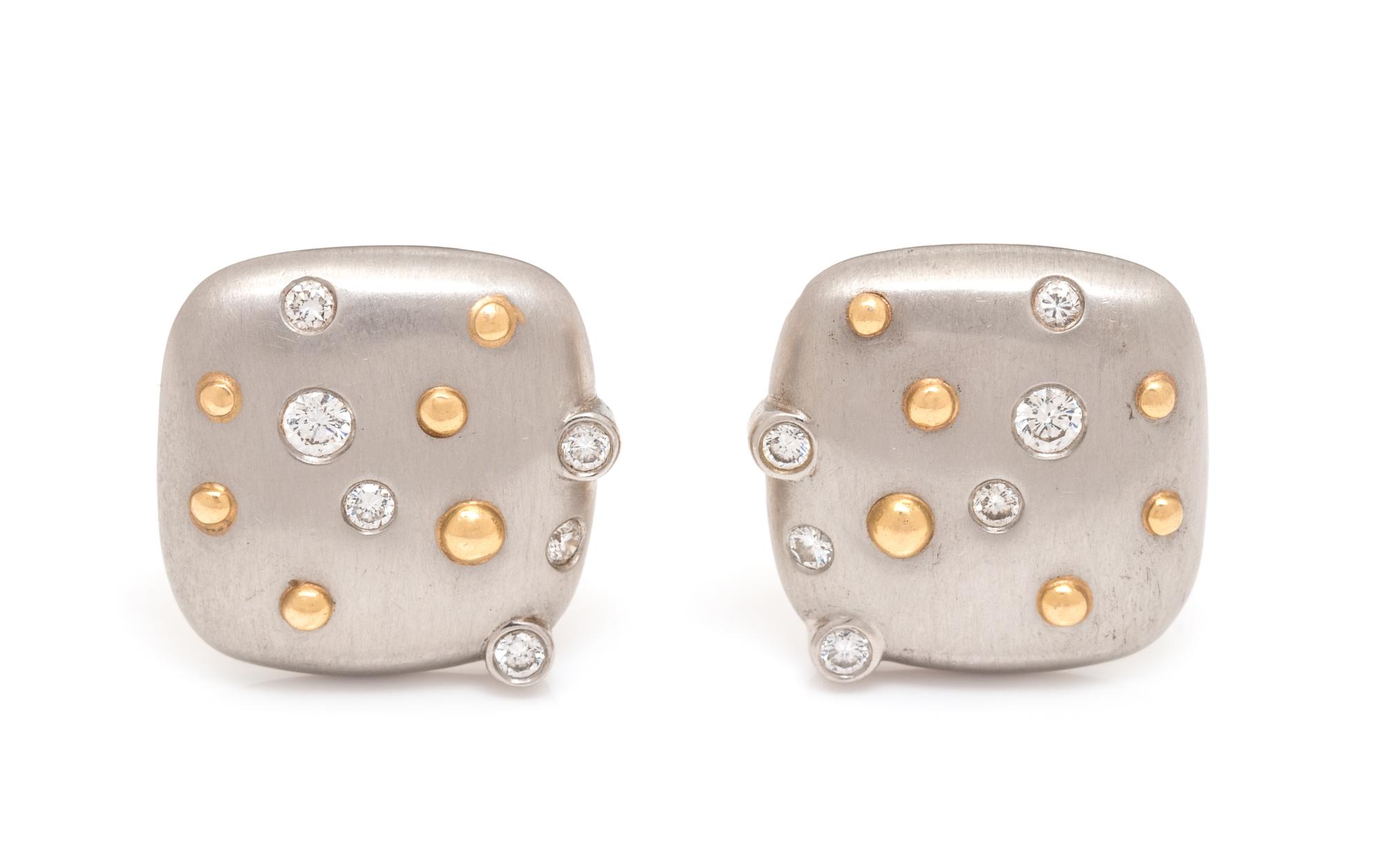 A Pair of Platinum, 18 Karat Yellow Gold and Diamond Earclips,