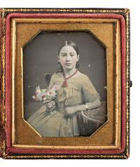 [EARLY PHOTOGRAPHY]. Sixth plate beautifully hand-tinted daguerreotype of 10-year-old Caroline Cunningham Beall wearing a yellow dress.