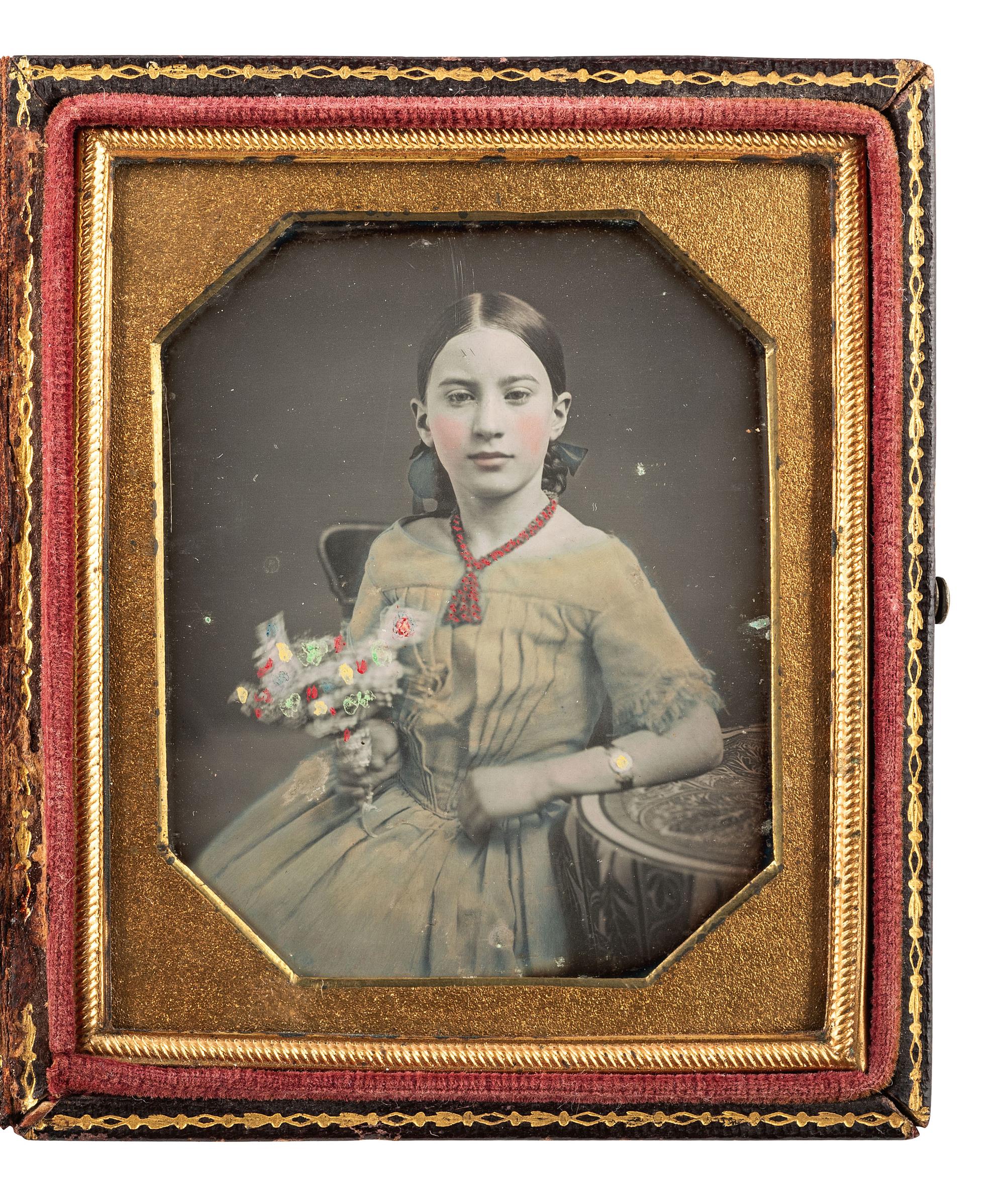 [EARLY PHOTOGRAPHY]. Sixth plate beautifully hand-tinted daguerreotype of 10-year-old Caroline Cunningham Beall wearing a yellow dress.