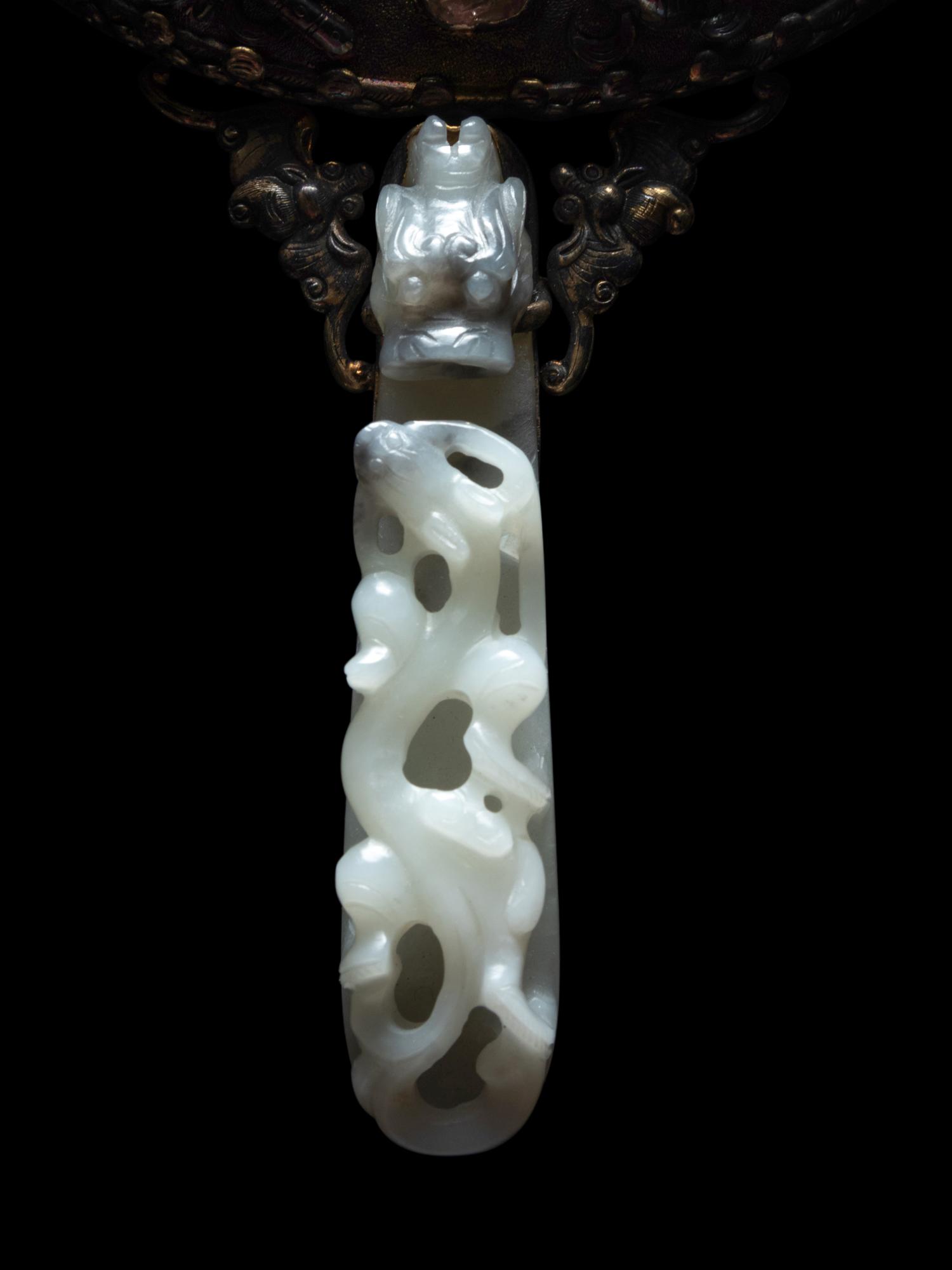 A White Jade Mounted and Hardstone Embellished Hand Mirror