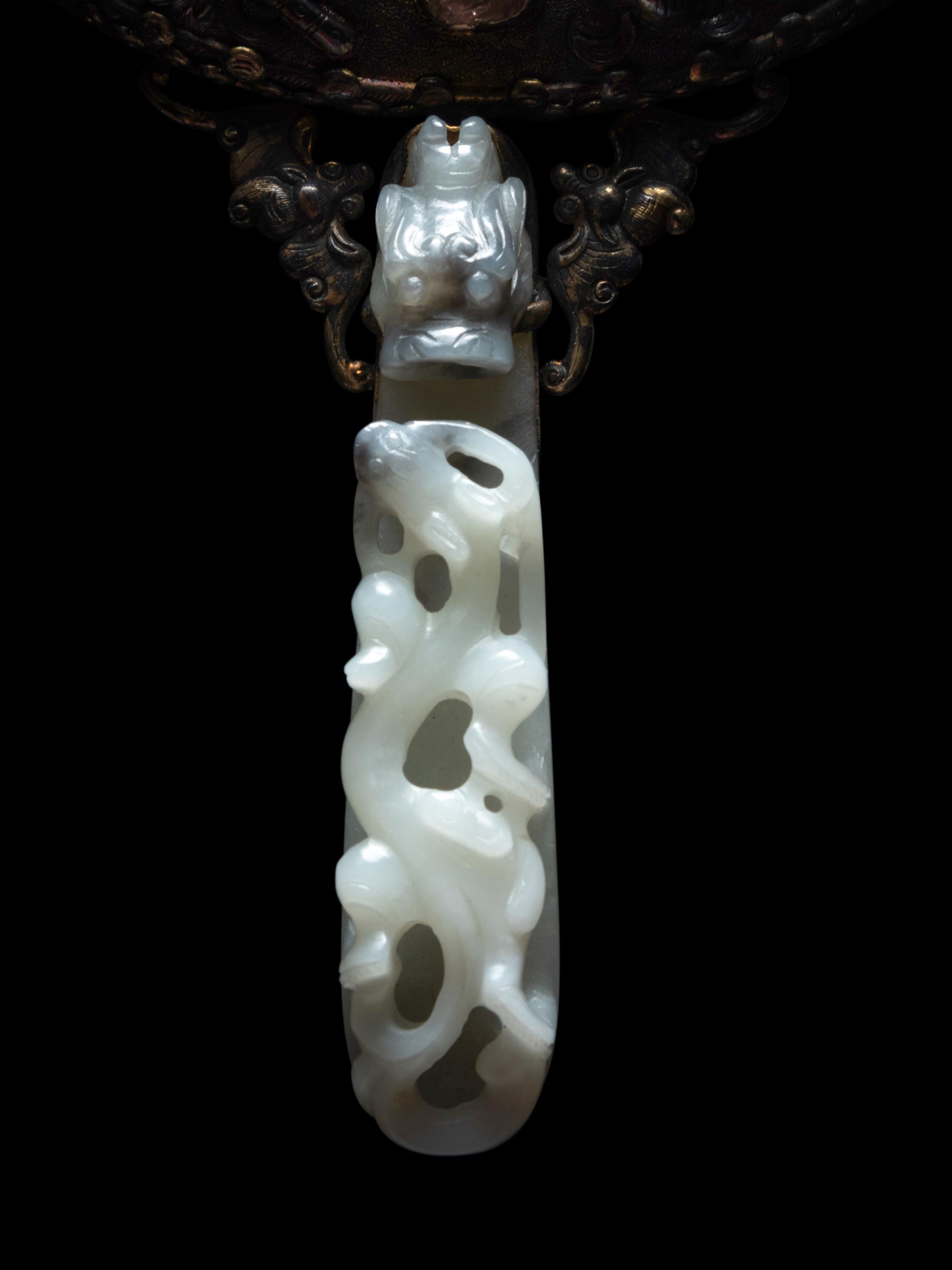 A White Jade Mounted and Hardstone Embellished Hand Mirror