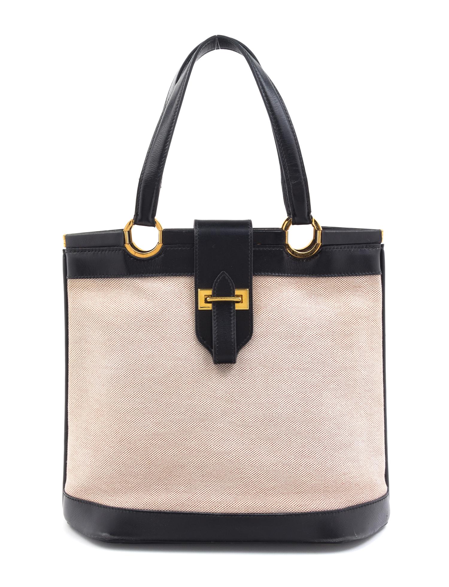 An Hermes Black Leather and Canvas Handbag, 10" x 12" x 3".