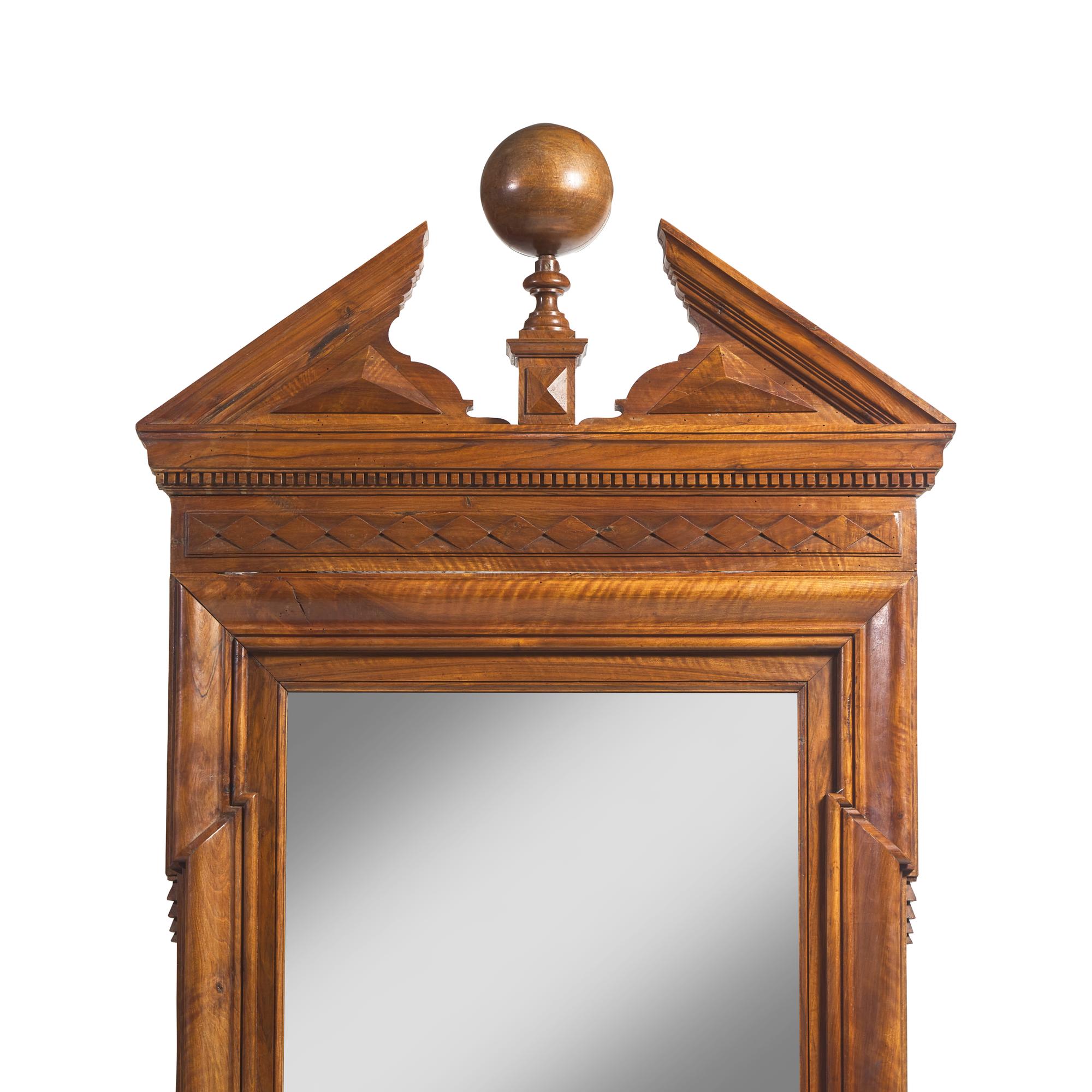 A Large Neoclassical Carved Walnut Mirror