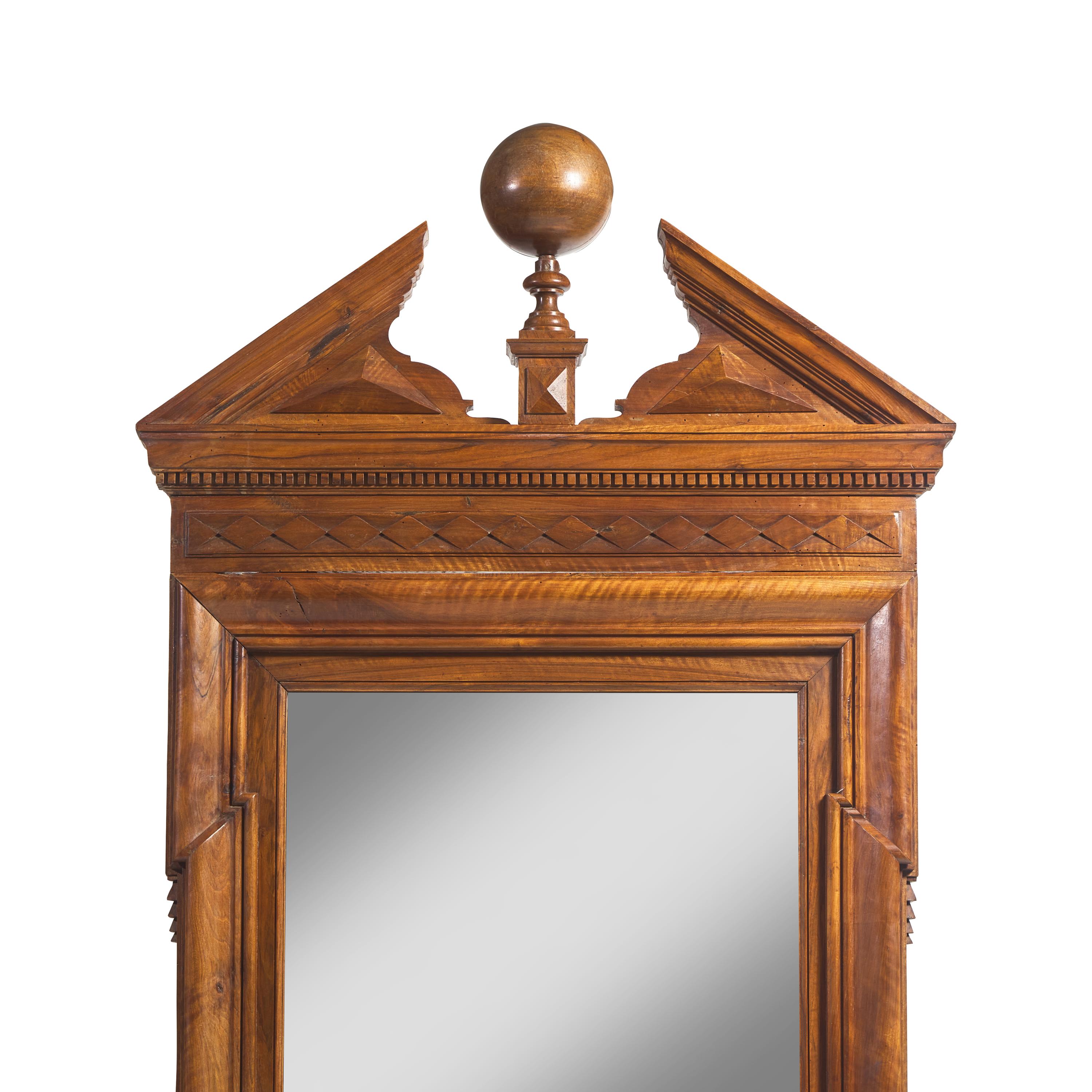 A Large Neoclassical Carved Walnut Mirror