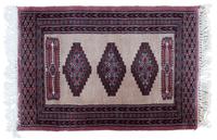 A Wool Rug 3 feet x 2 feet 1/2 inches.