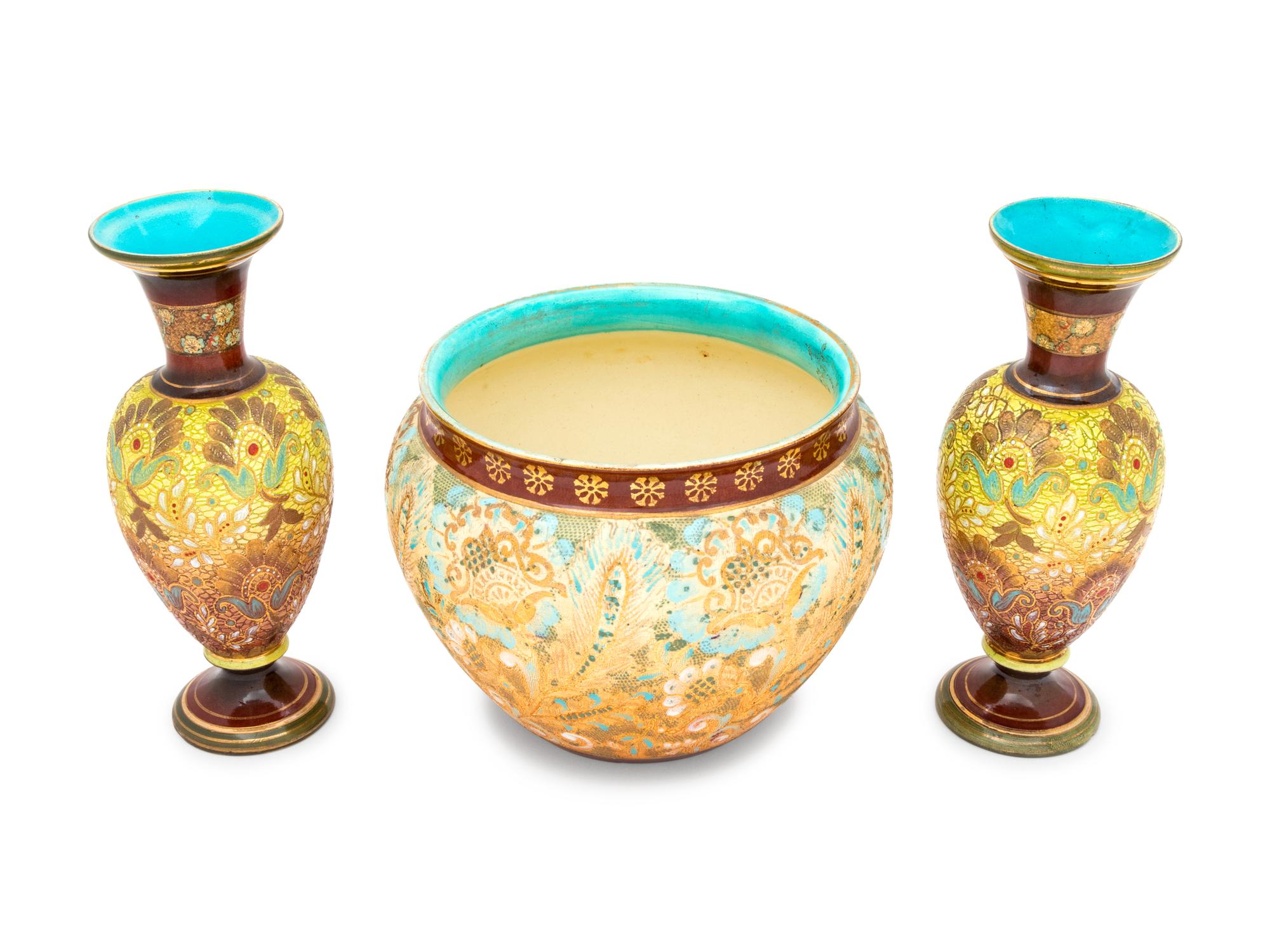 A Pair of Doulton Lambeth Stoneware Vases and a Doulton Lambeth Stoneware Jardinière