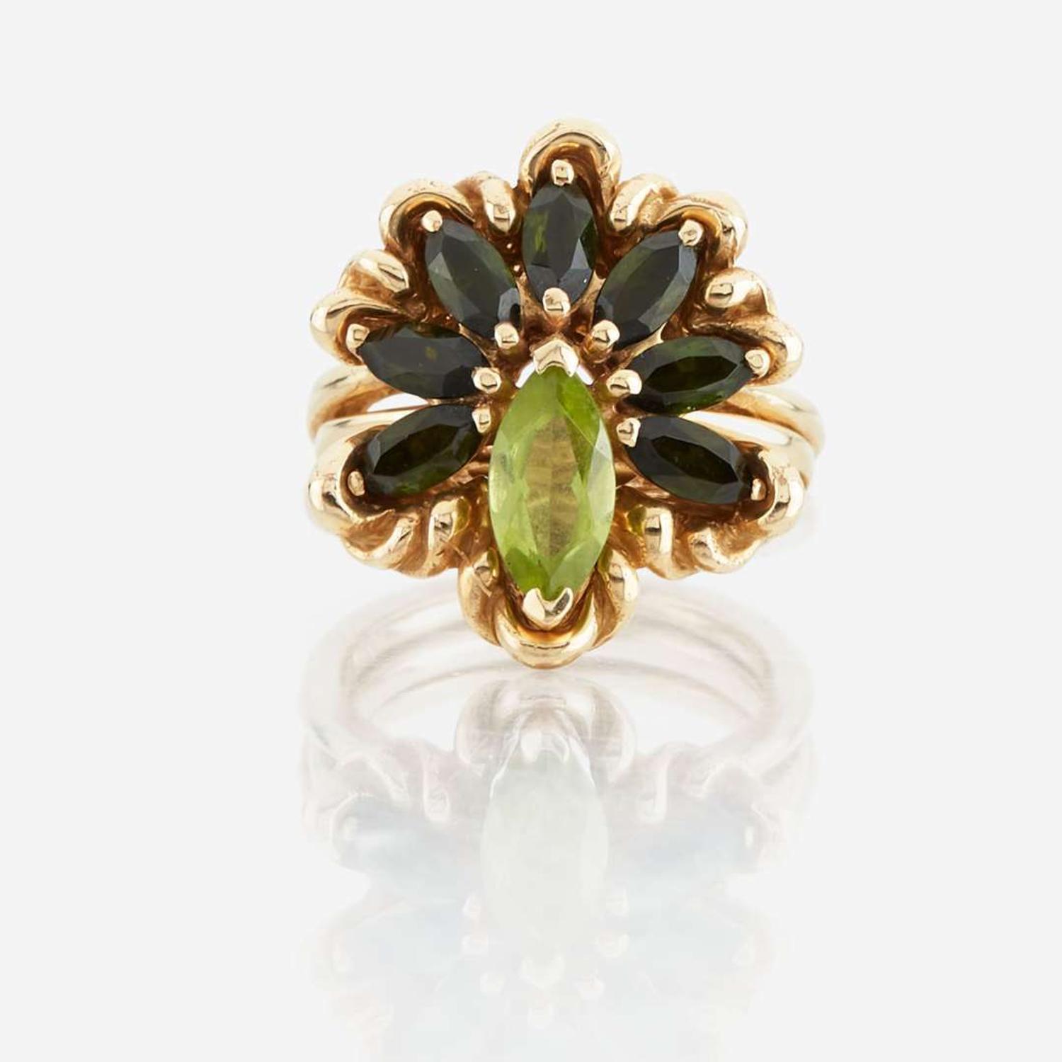 A peridot, green tourmaline, and gold ring