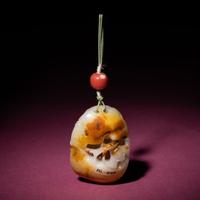 A Chinese Russet and White Jade Reticulated Pendant, 18th/19th Century — 清中期 白玉帶皮鏤雕石榴荔枝佩