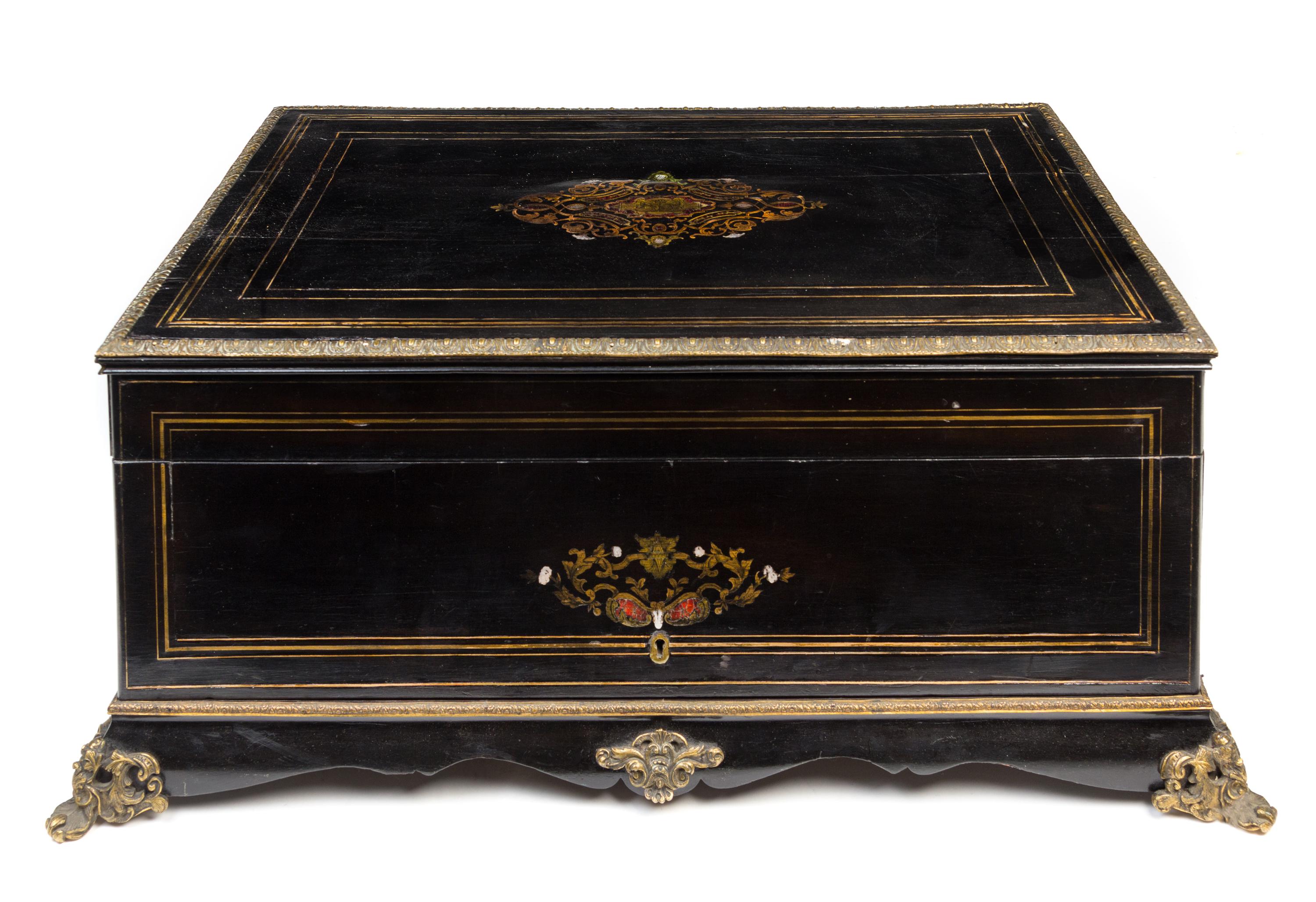 A Napoleon III Brass Inlaid Ebonized Writing Box Width 26 inches. — 19TH CENTURY