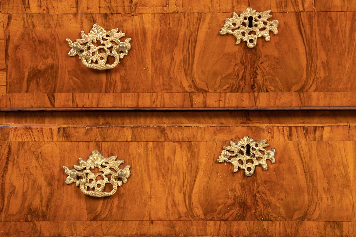 A German Gilt Bronze Mounted and Parcel Gilt Burl Walnut Bombe Chest in the Louis XV Taste