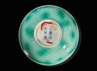 A Chinese incised porcelain faux-jadeite "Dragons" bowl, Tongzhi mark and of the period 龍紋瓷盌 同治款 清同治