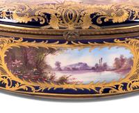 A Sèvres Style Painted and Parcel Gilt Porcelain Table Casket