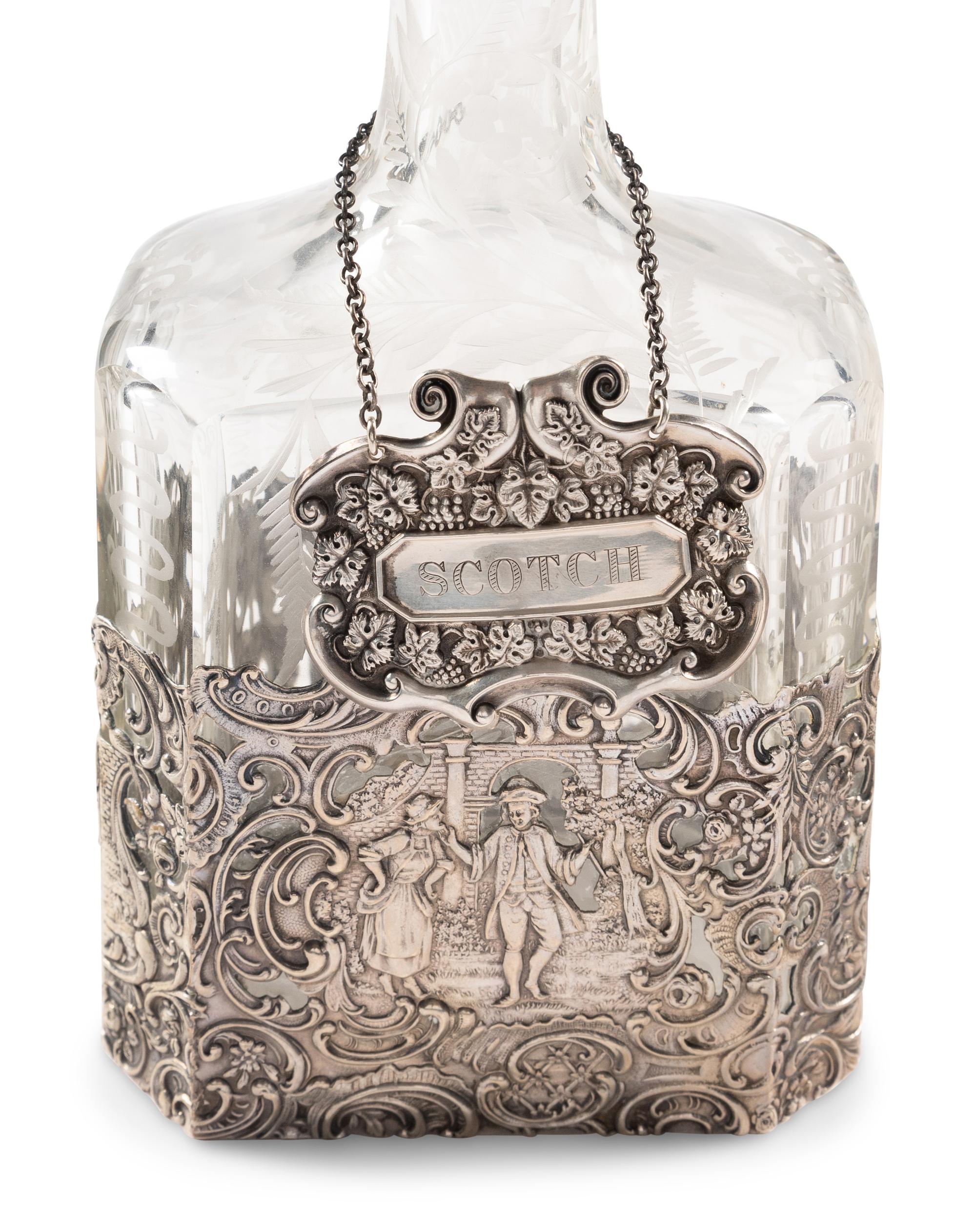 Two Silver Mounted Etched Glass Decanters