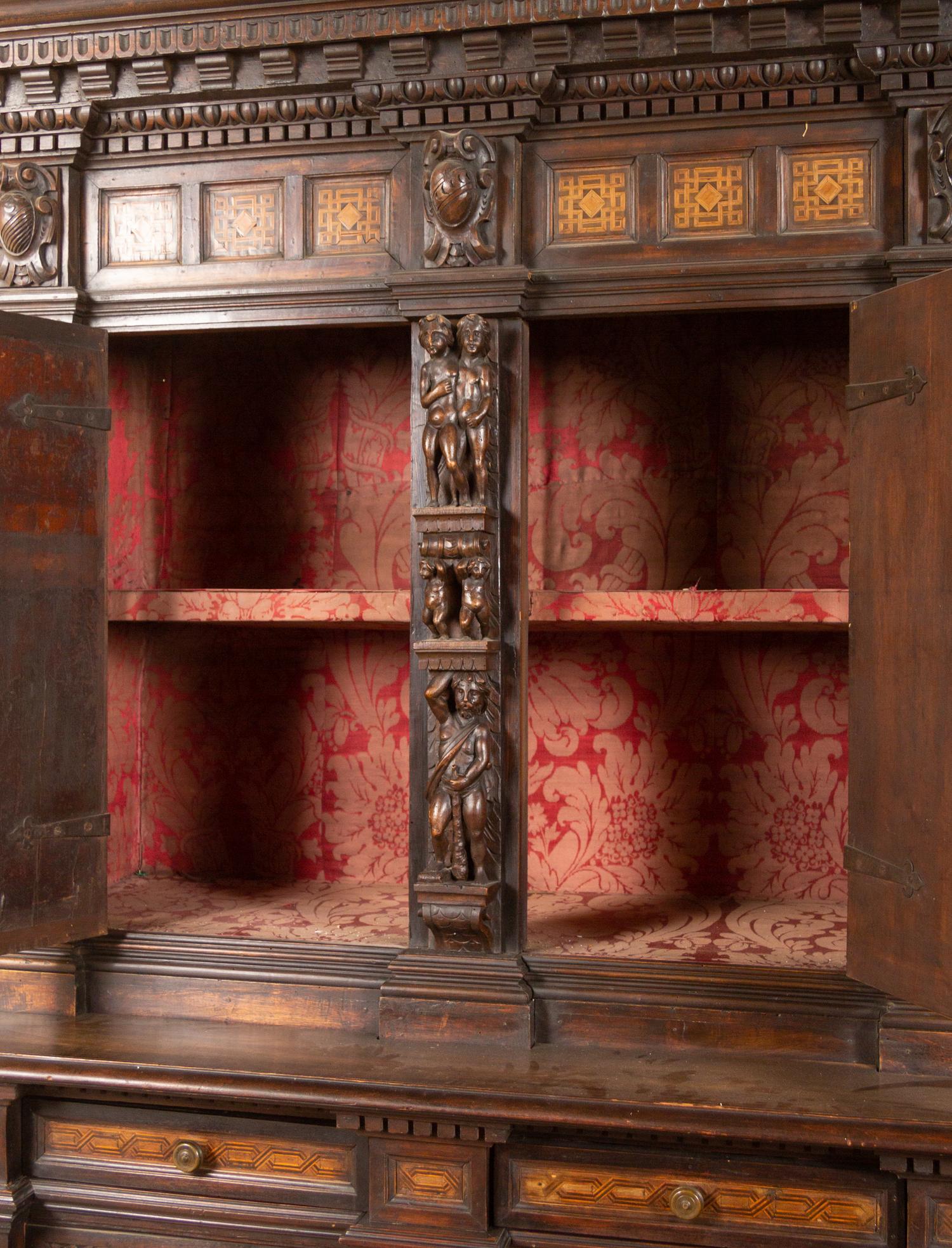 An Italian Baroque Style Carved Walnut and Marquetry Cabinet on Stand